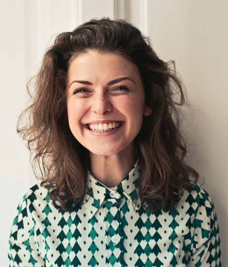 woman smiling with dental bridges in Montecito